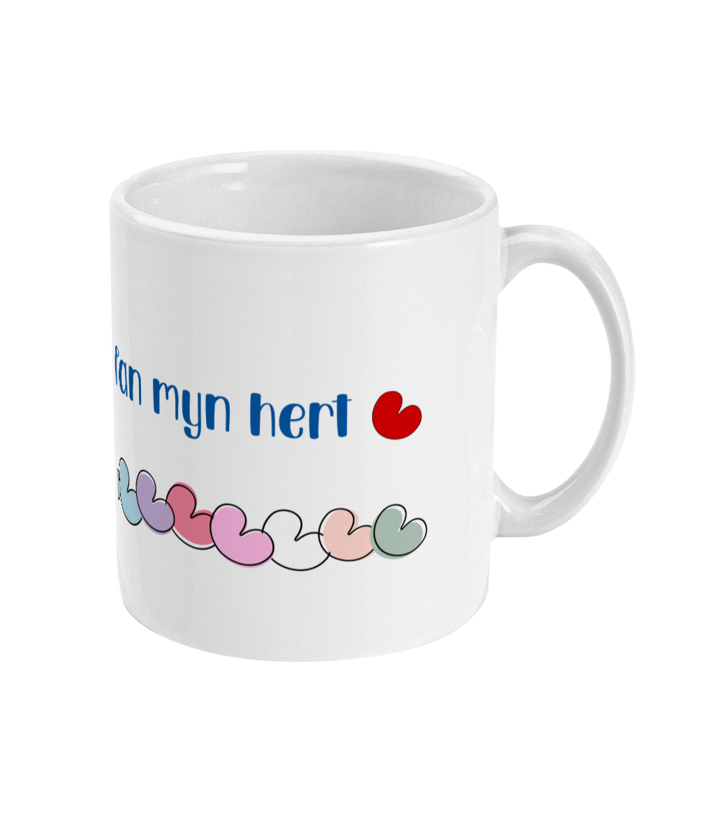 Witte mok met pompeblêd en tekst fan myn hert